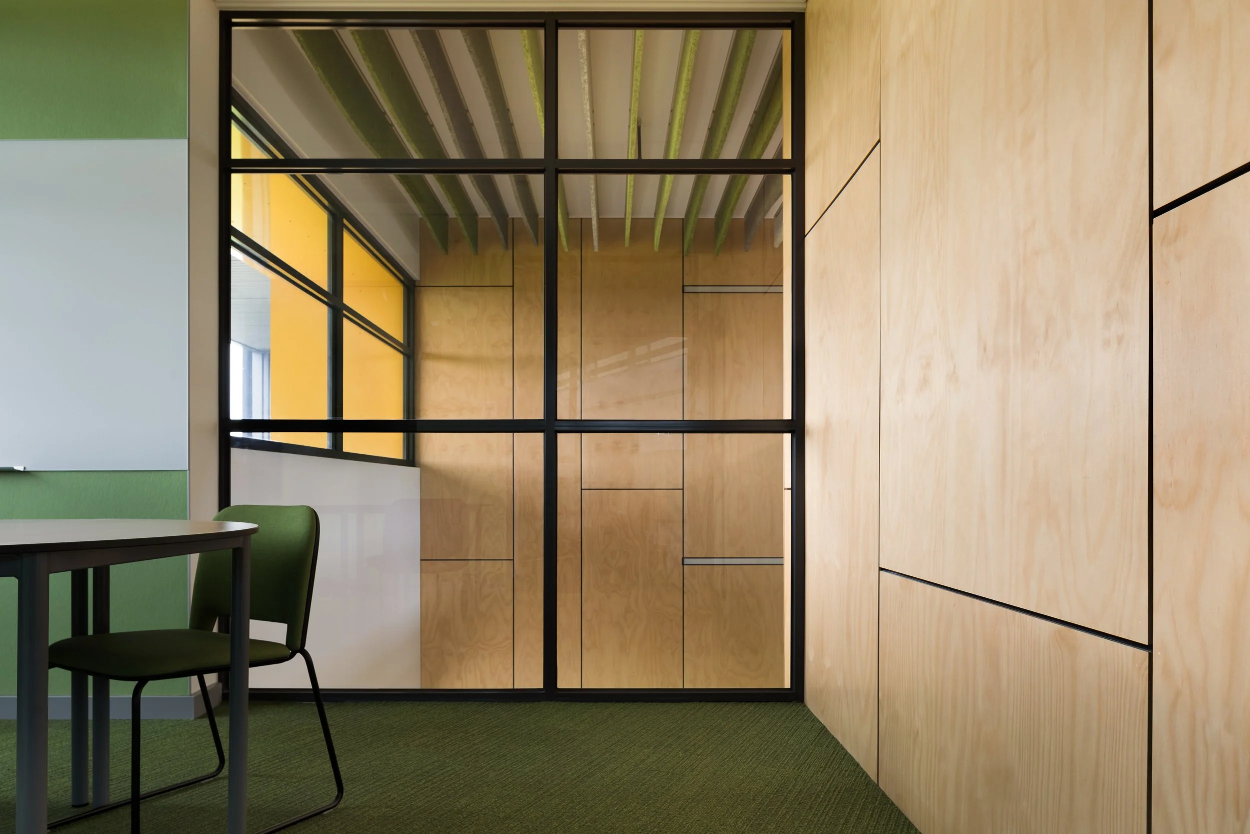 interior architecture of iona college by clarke hopkins clarke with lyons building group photographed by geelong photographer sarah anderson photography for kildare construction group interior walls clad with ply and green carpet