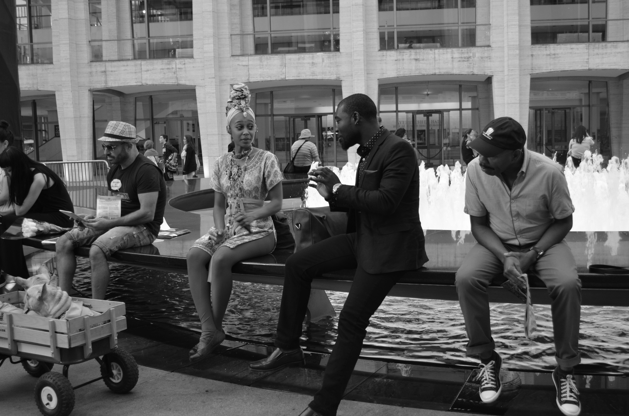 One lady, three men at Lincoln Center - New York Fashion Week.
