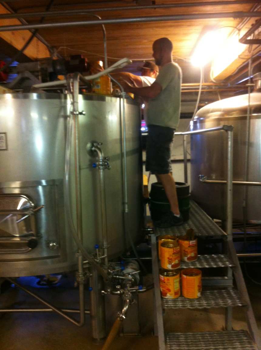 Chris and Ryan adding pumpkin to the mash tun for Ichabod's Midnight Ride.