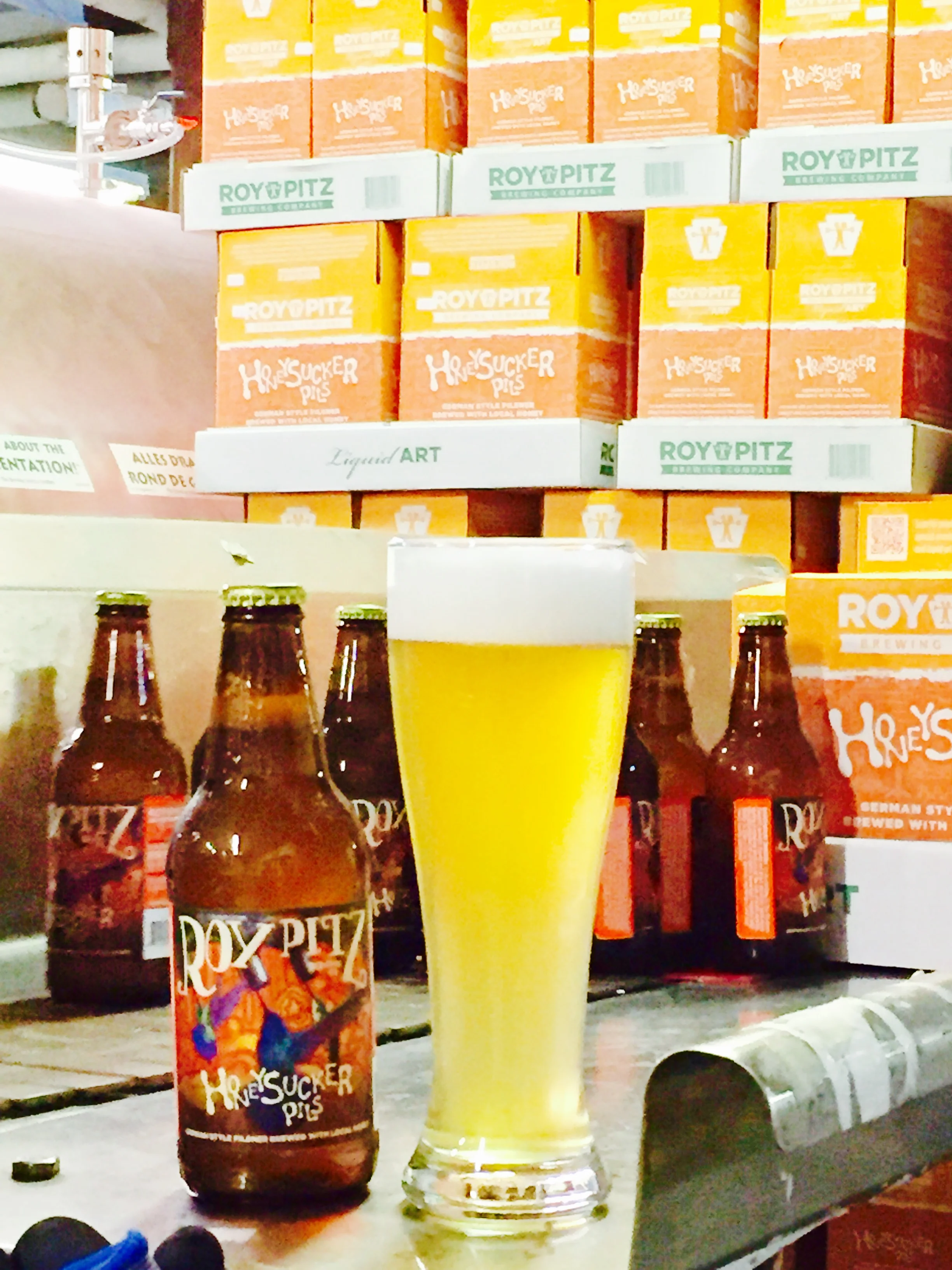 First bottle and full glass off of the bottling line.