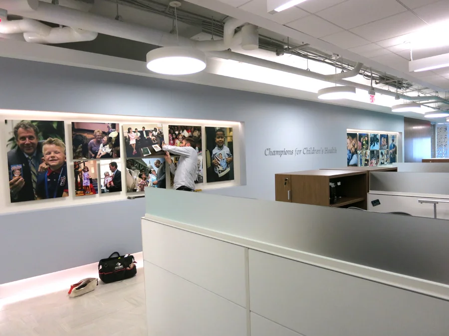 The Mission Wall features two inset areas where photographs printed on aluminum were installed.