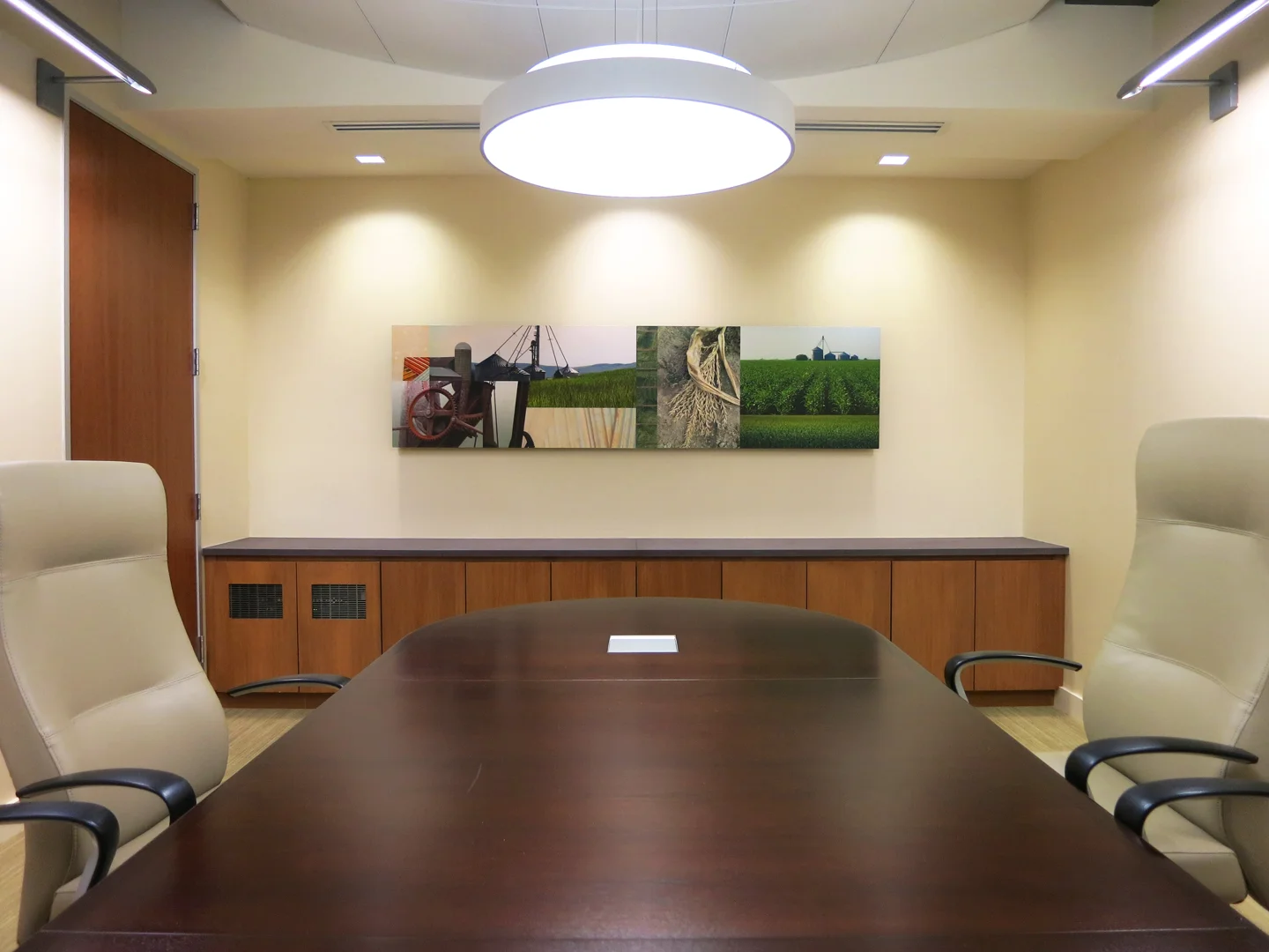 A Conference Room features a custom photo collage above the credenza.