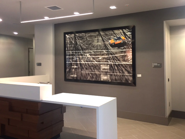A huge photo of a DC taxicab visually grounds the reception desk.