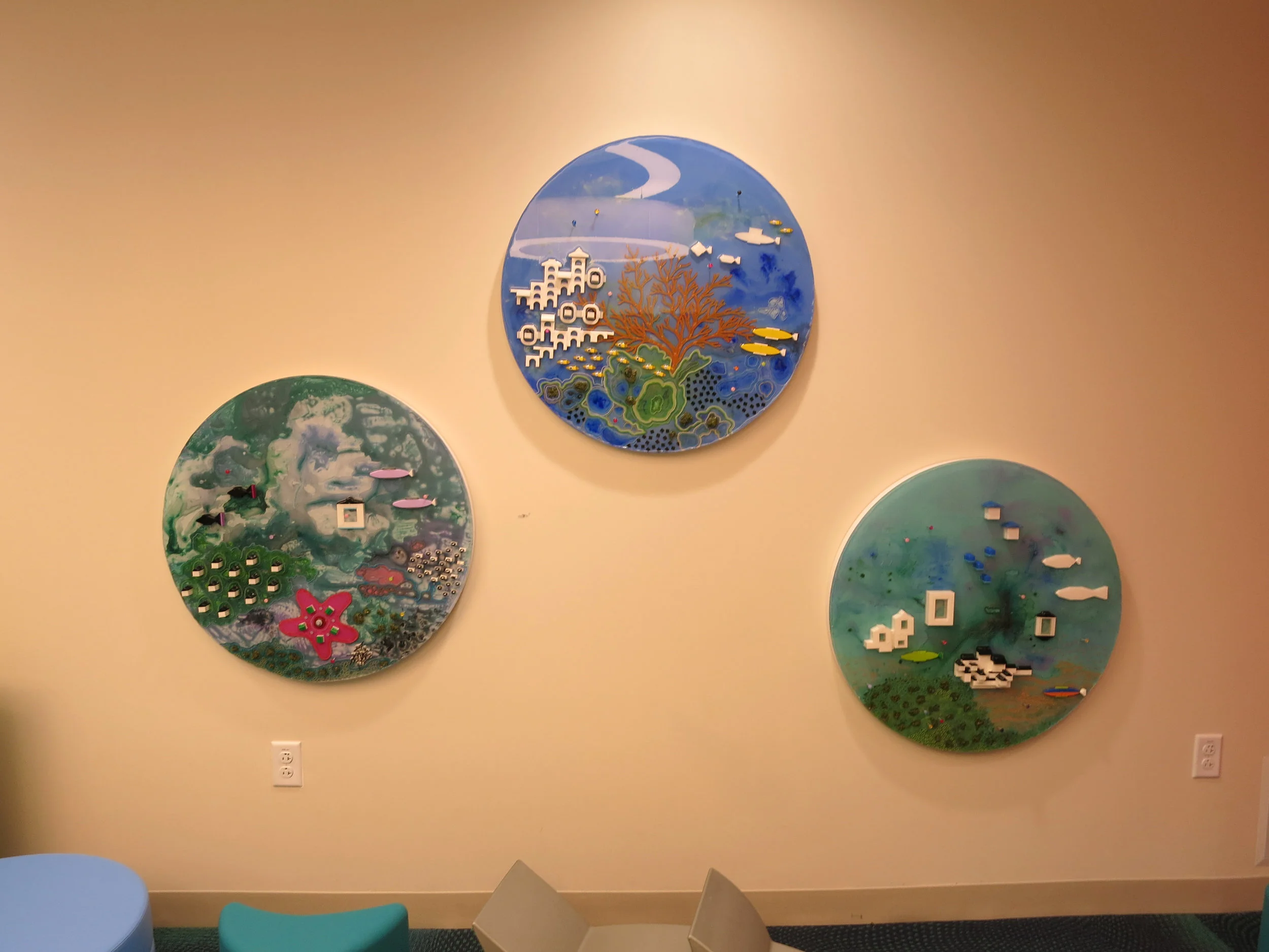 These fun pieces are made of sculptured plastic embedded in painted resin. They are meant to be touched by children, providing an interactive experience.