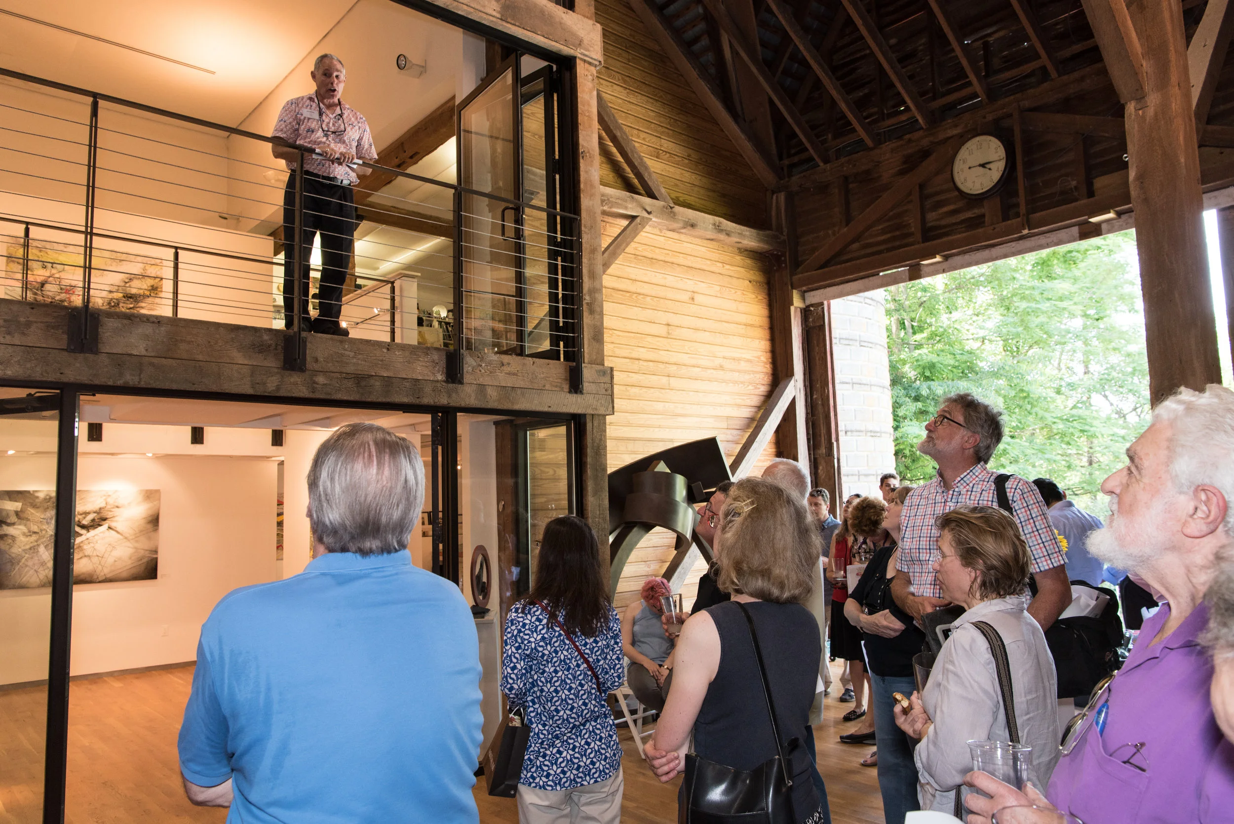 Principal Jack Devine gives a quick introduction about the barn and the artists' work.