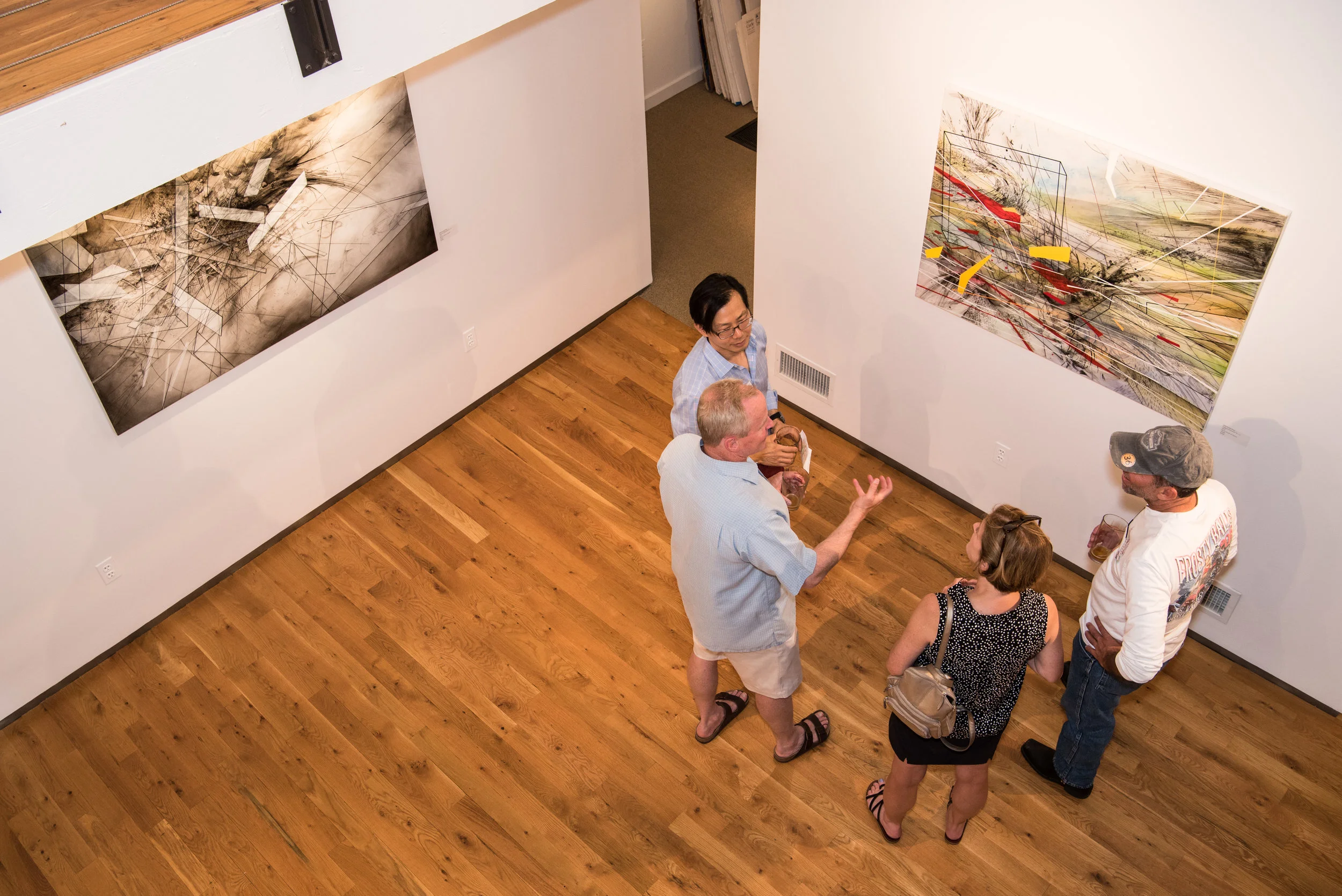 Visitors enjoy speaking with artist Chee Keong about his process.