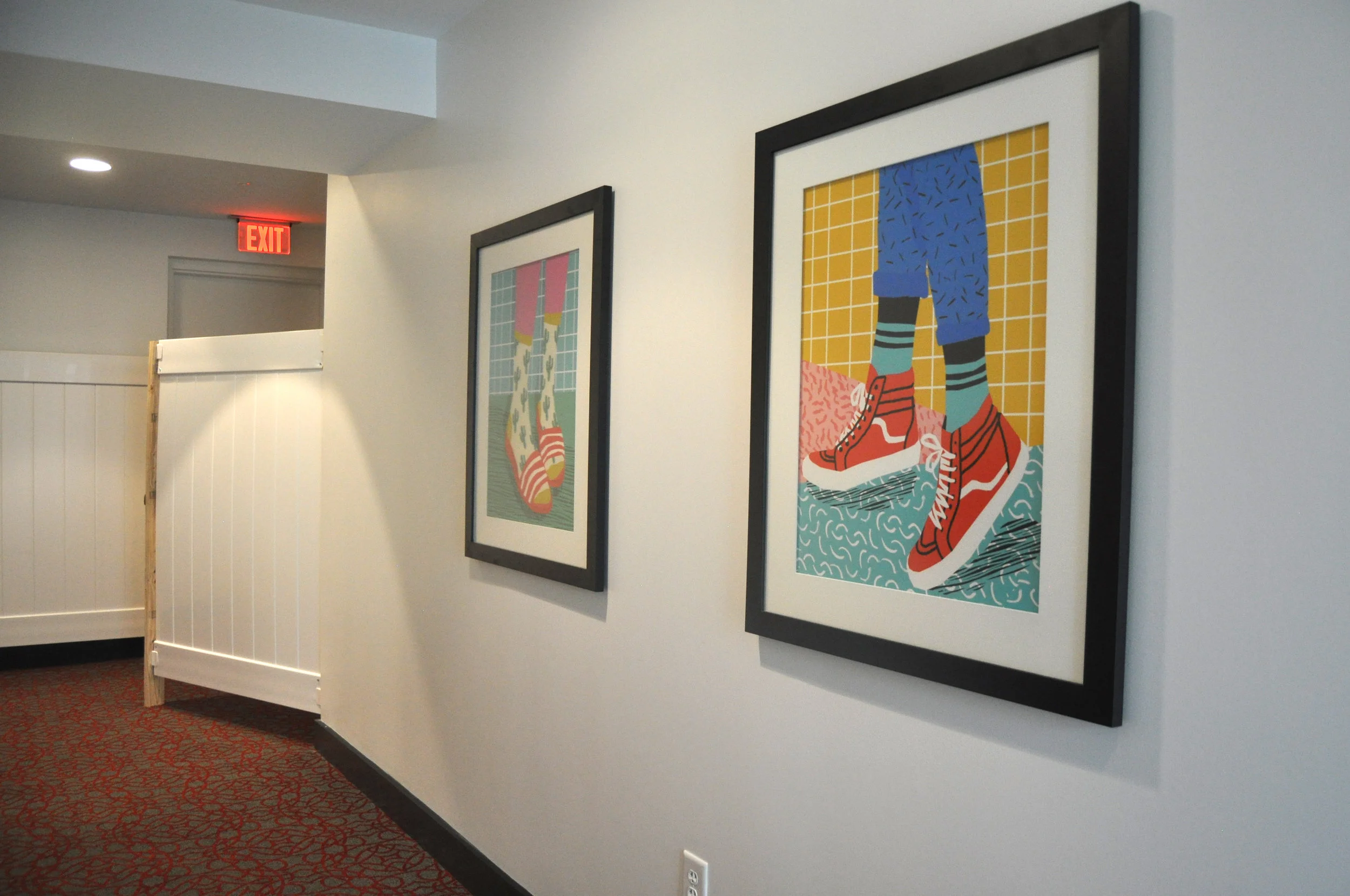 Funky feet outside the mens' and ladies' restrooms.