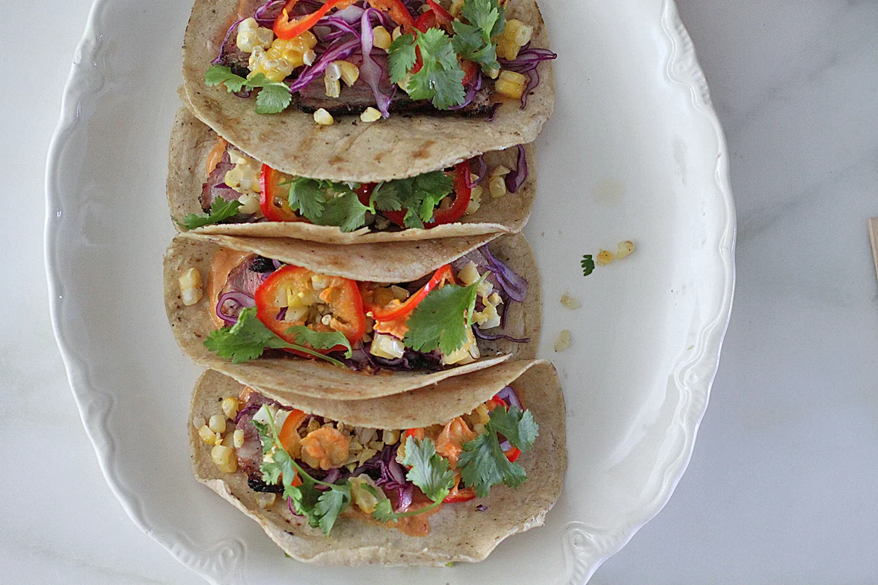 Grilled Lamb Sirloin Tacos with Corn, Pickled Cherry Peppers & Chipotle Crema