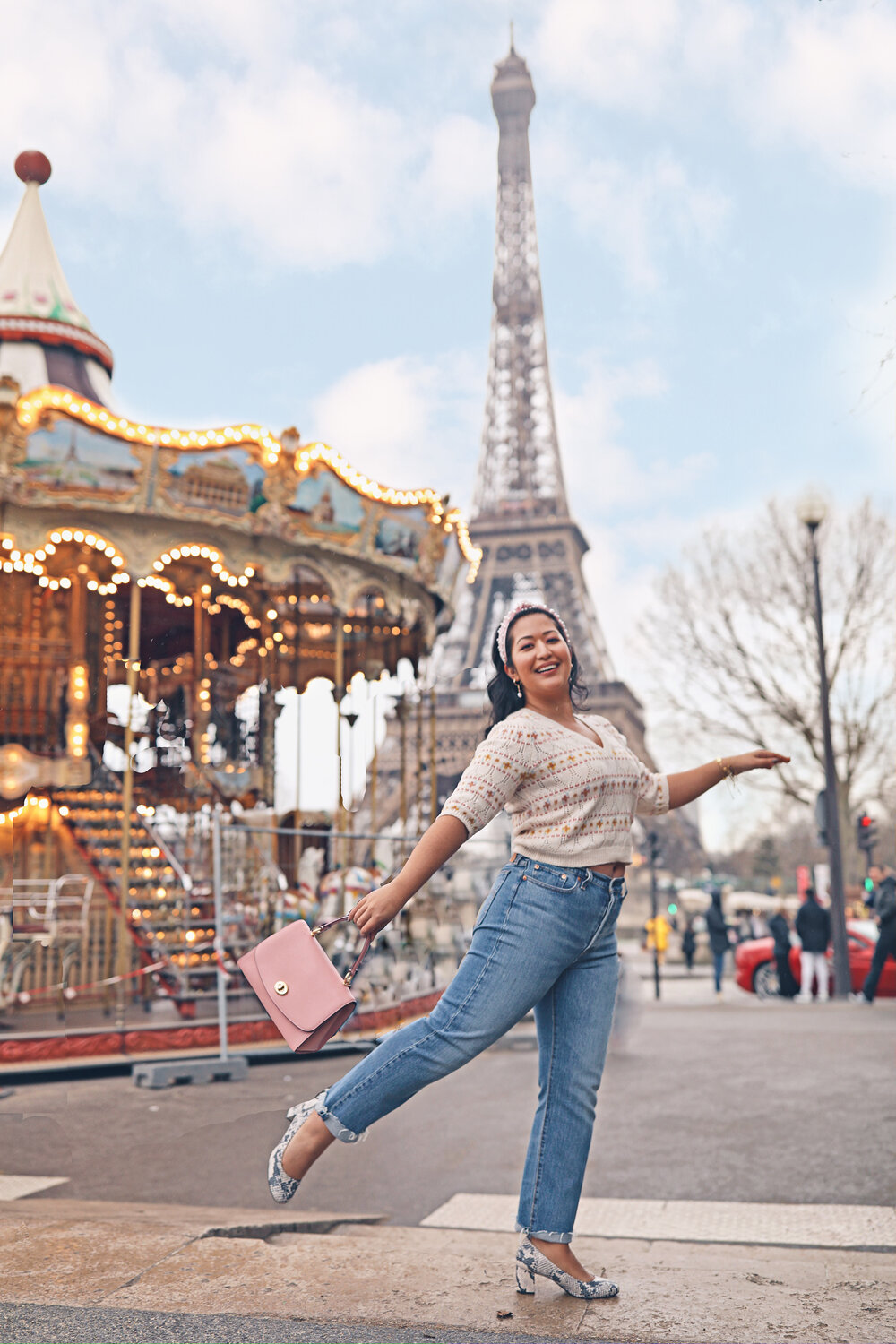 Carousel at the base of the Eiffel Tower Paris Instagramable Photo Location – Pink Purse and Zara Sweater 