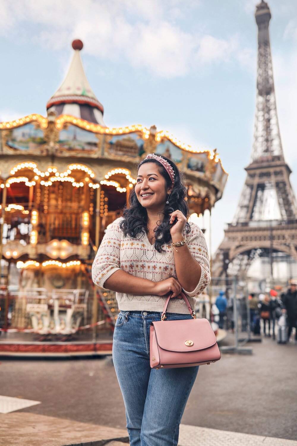 Carousel at the base of the Eiffel Tower Paris Instagramable Photo Location – Pink Purse and Zara Sweater 