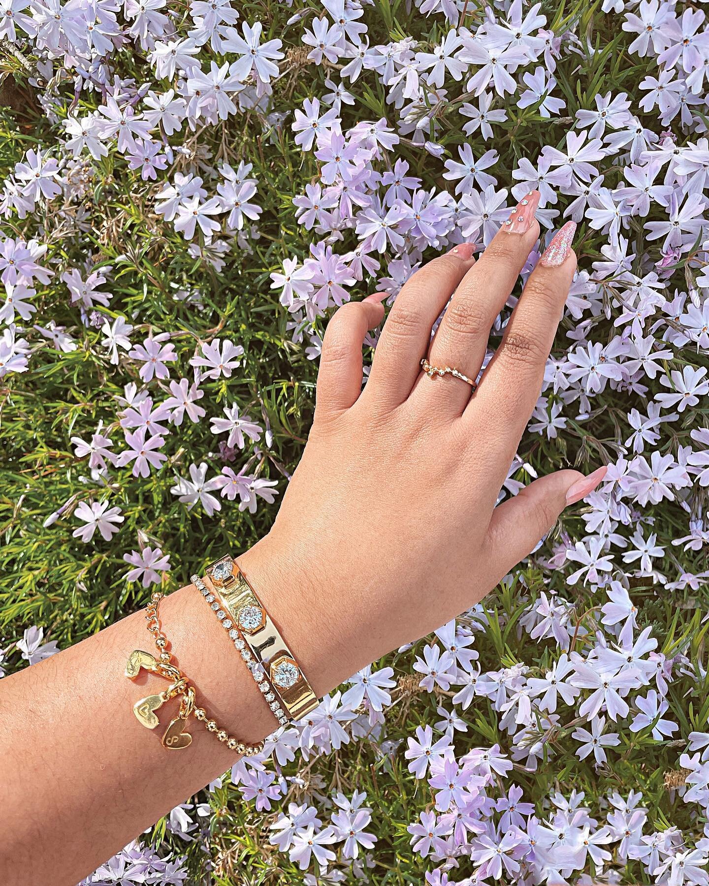 My Spring stack! I've always been one to wear a lot of bracelets. When I was a little girl, in Nepal, I used to wear bangles on both arms (Bollywood style). Not much has changed 20+ years later. ⁠⁠
⁠⁠
I am loving the personalized Heart Bracelets from