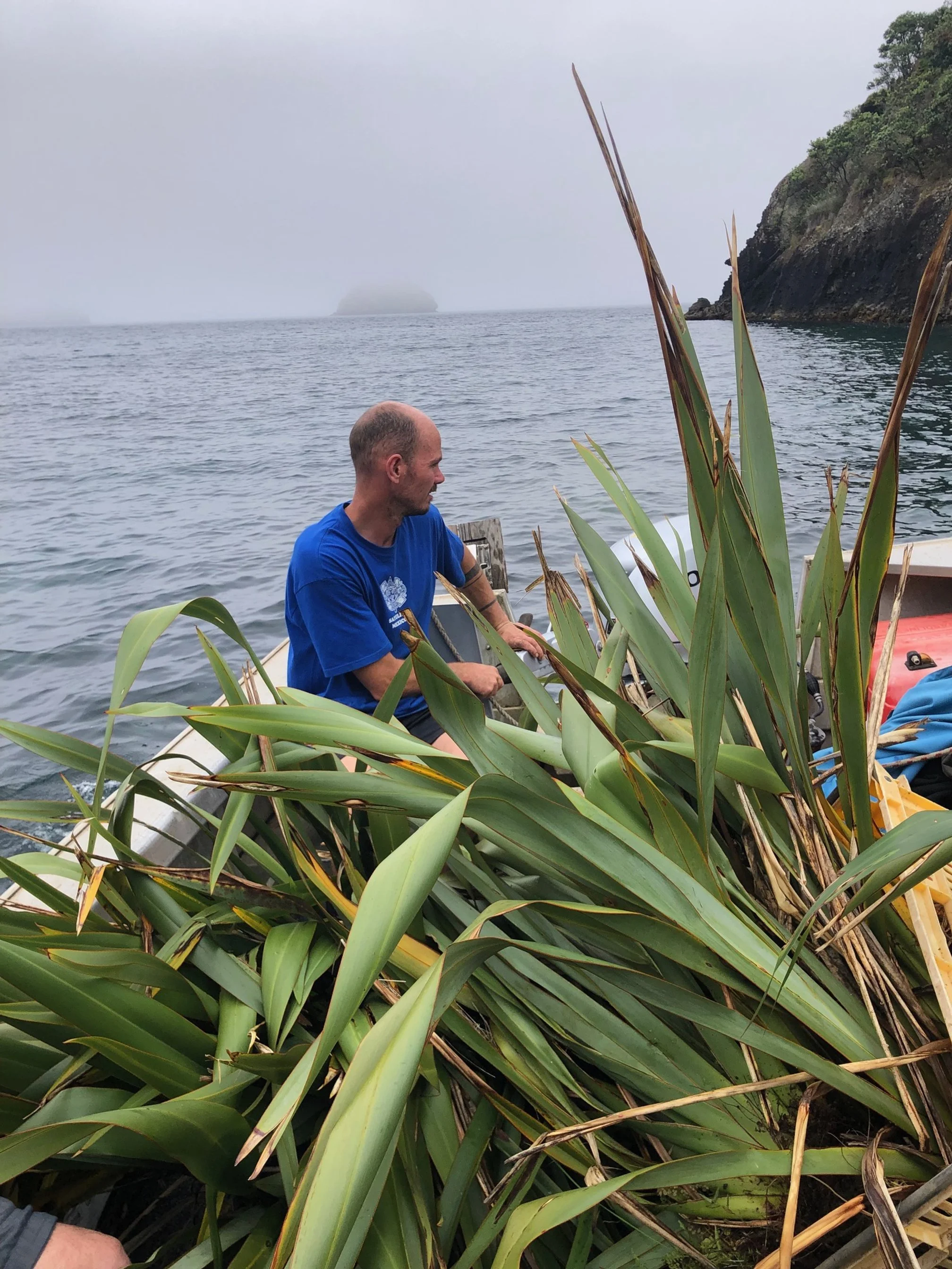   Clint with harakeke in his boat (Credit: Barry Scott)  