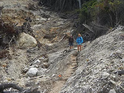  Caroline Ogden and Jim Kerr crossing the big slip on the way to the Mt. Heale hut. Slip created 10th April, 2014; Photo 11 Feb. 2015. 