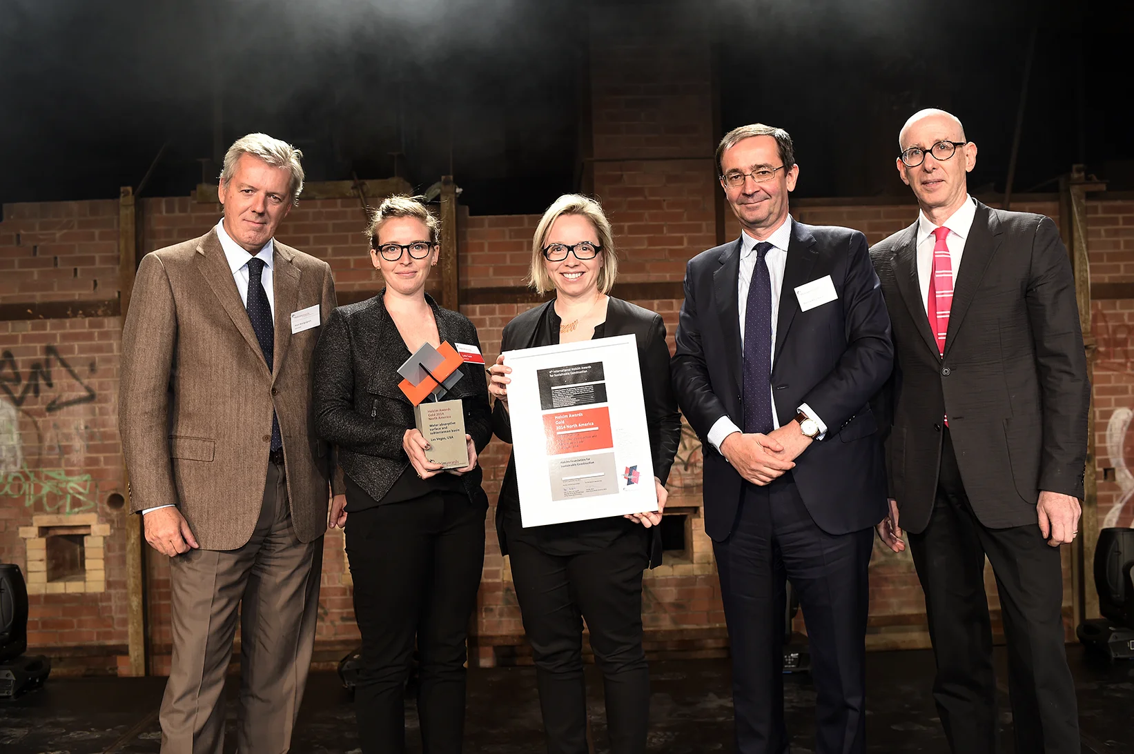 Holcim Awards North American ceremony, Toronto, Canada Presentation of the Holcim Awards Gold 2014 for North America (left to right): Alain Bourguignon, Holcim Area Manager for North America and the United Kingdom; prize winners Caitlin Taylor and Amy Mielke, Water Pore Partnership, New York for "Poreform: Water absorptive surface and subterranean basin"; Bernard Fontana, CEO Holcim Ltd; and jury member Mark Jarzombek, Associate Dean, School of Architecture & Planning, Massachusetts Institute of Technology.