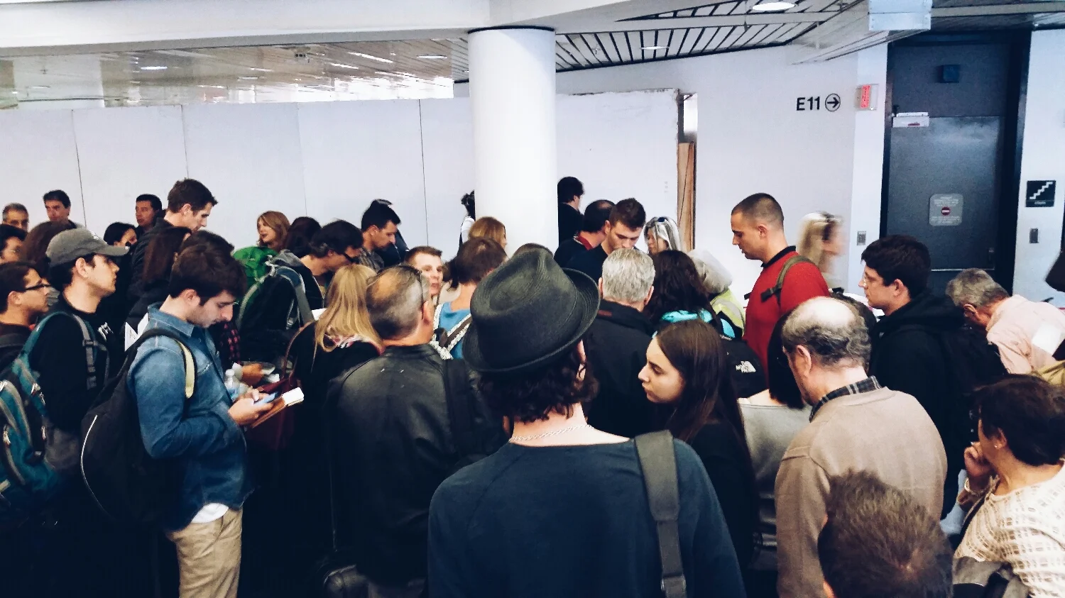 people crowding the boarding area.