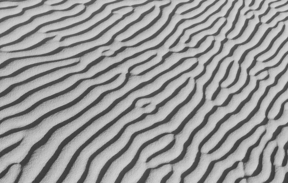 morning sun causing shadows on the dunes