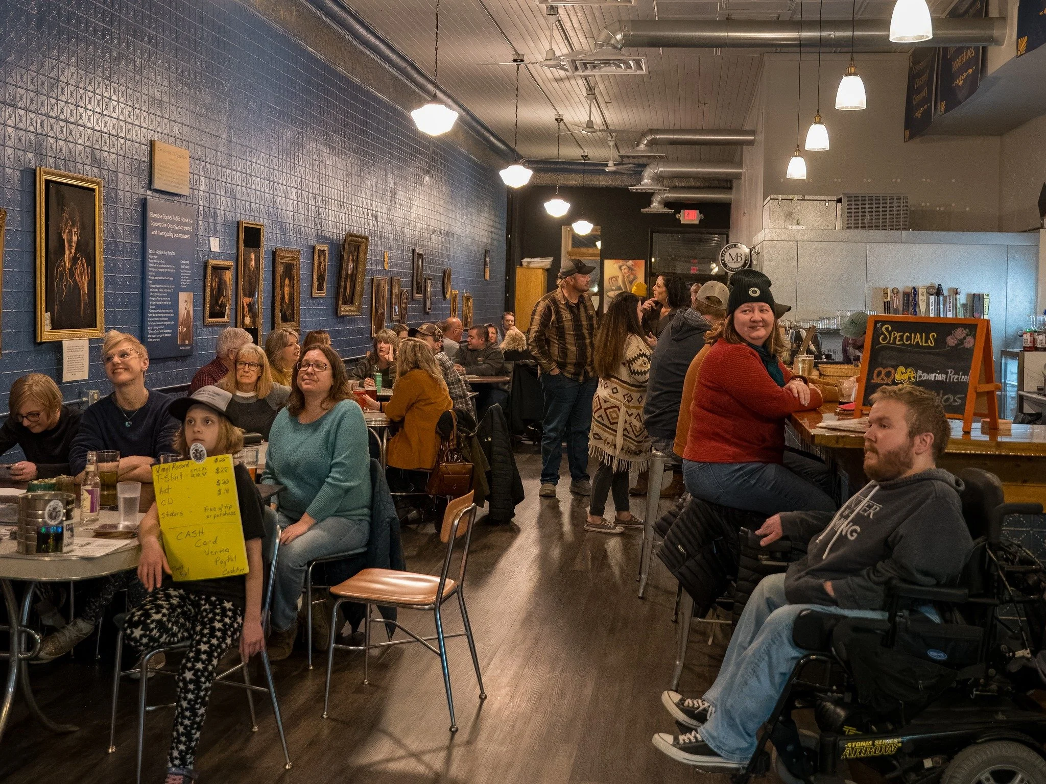 View from the front entrance of a full house during a live music event.jpg