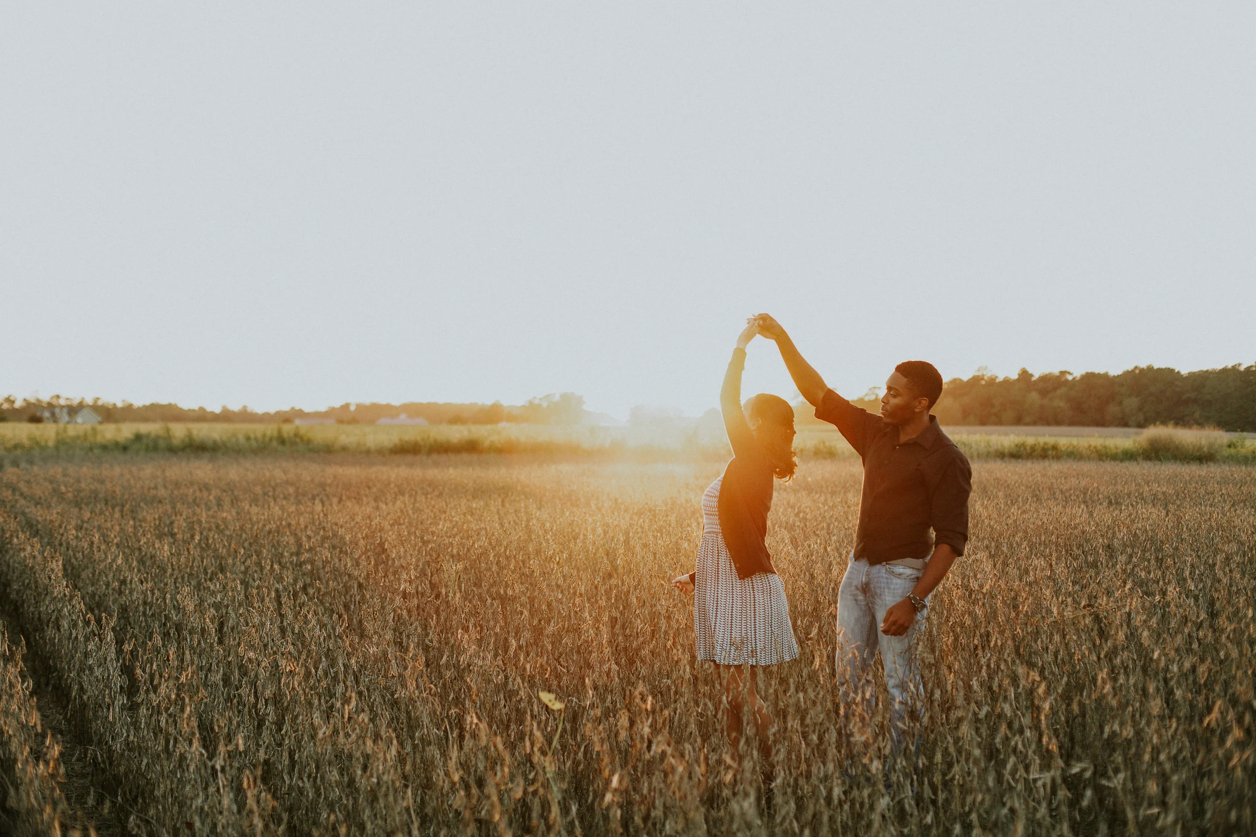 Delaware-Photographer walking during golden hour in a field