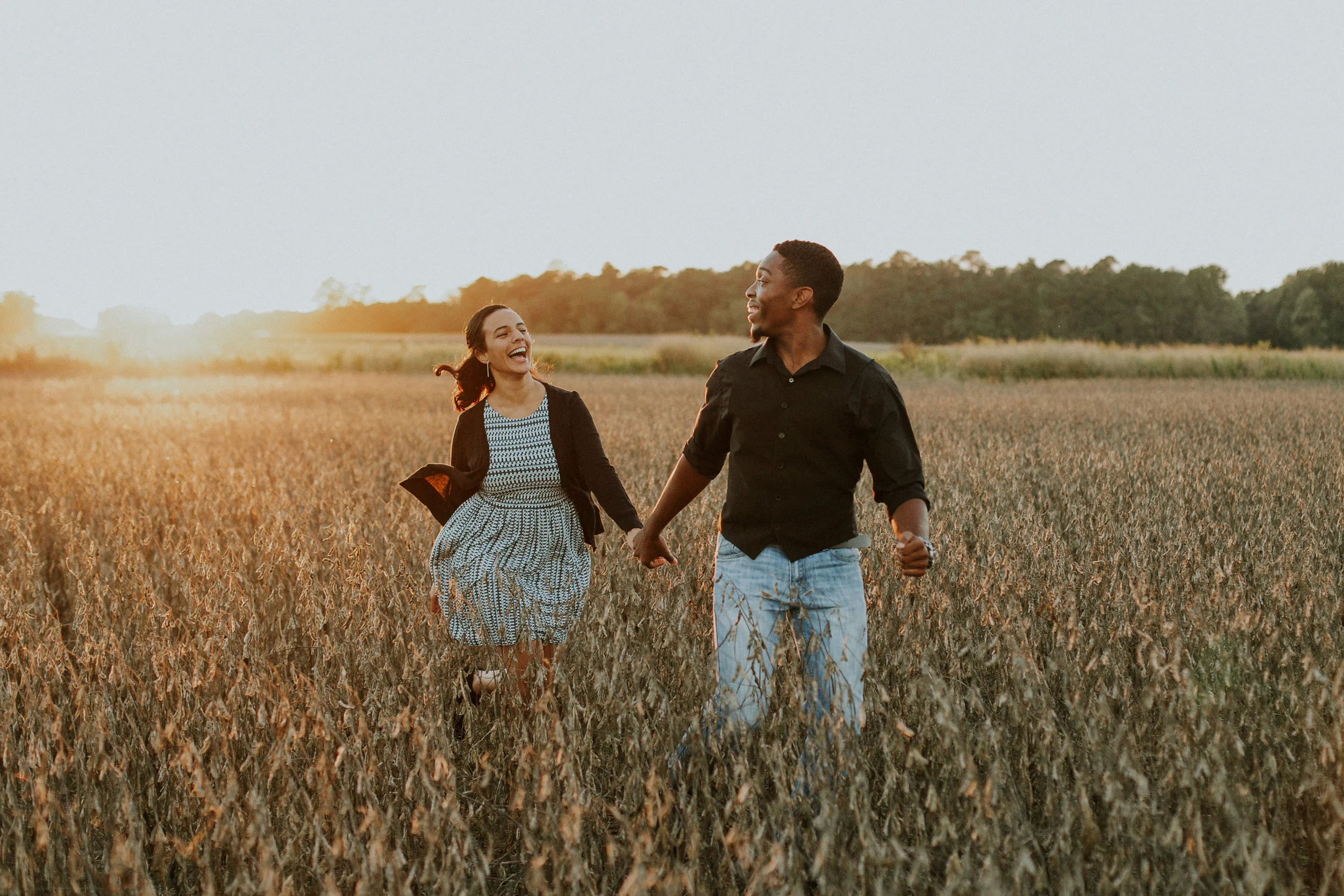 Delaware-Photographer walking during golden hour in a field