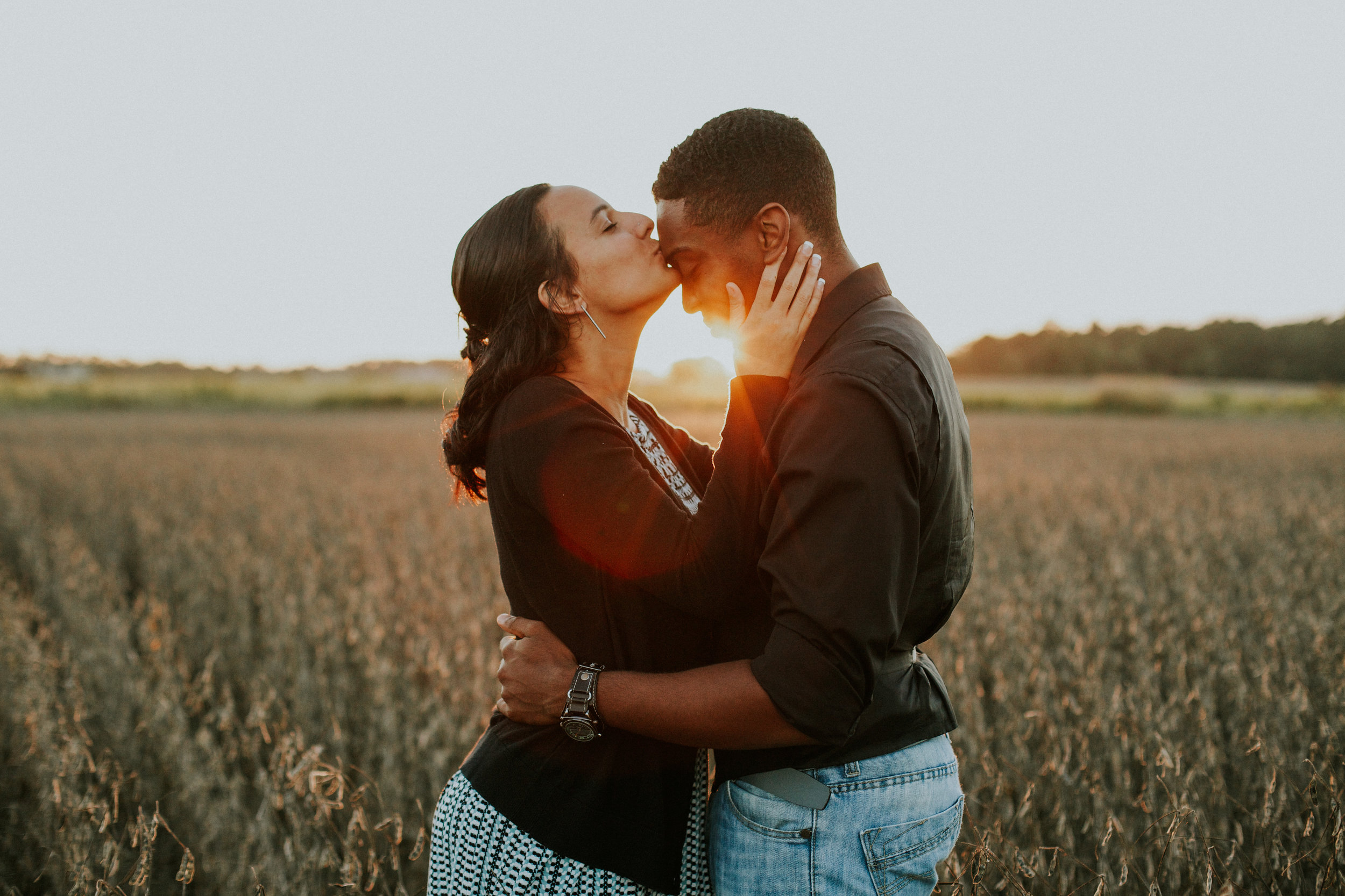 Delaware-Photographer walking during golden hour in a field