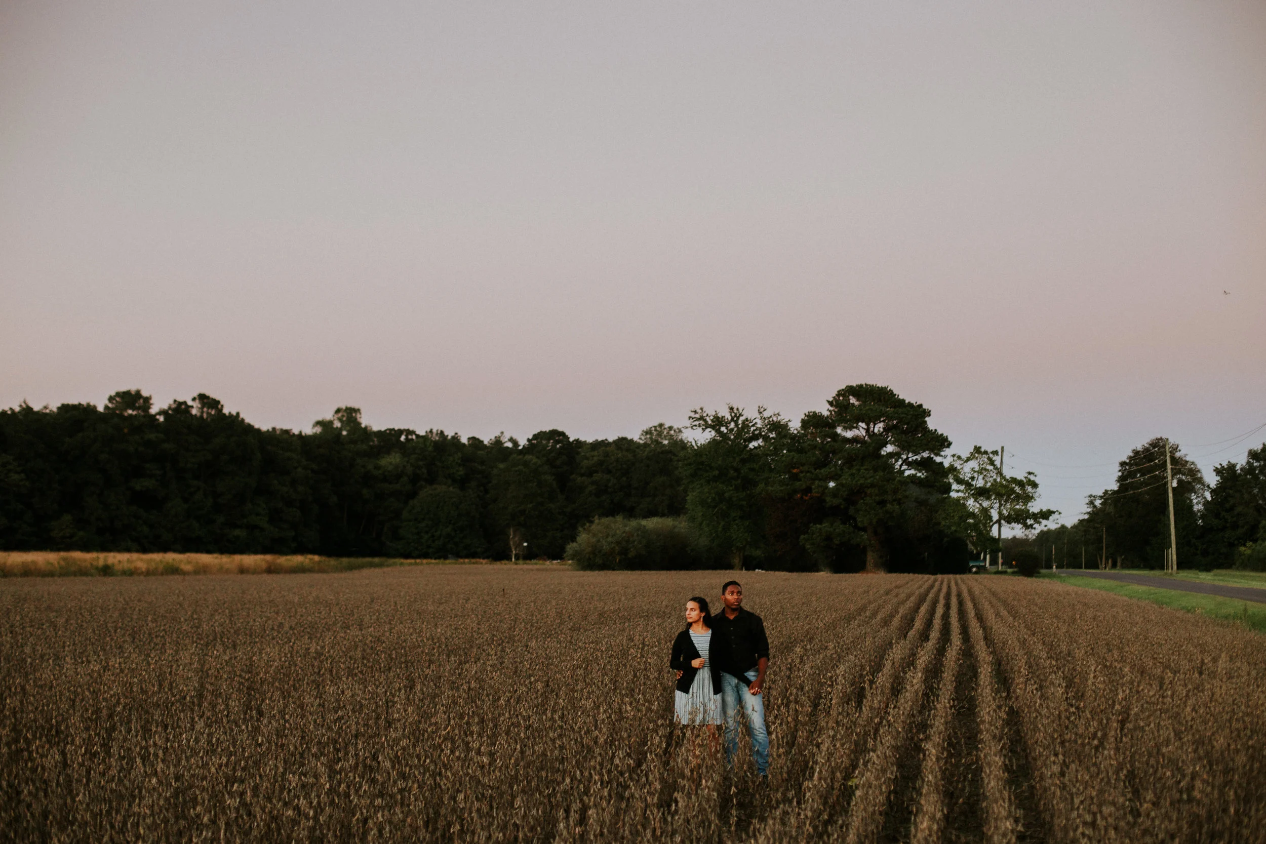 Delaware-Photographer walking during golden hour in a field