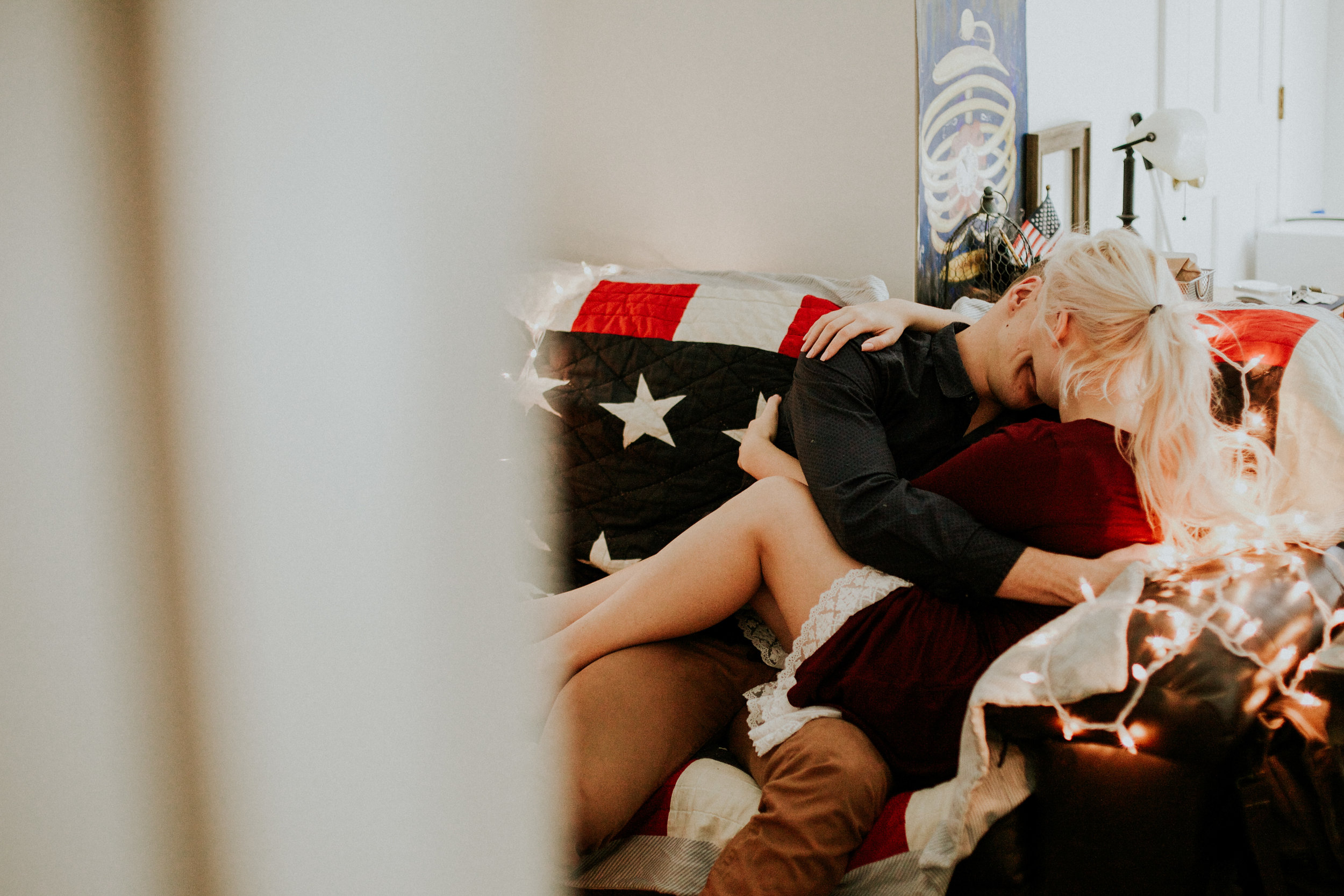 Gig harbor in home session blonde couple snuggle on couch&nbsp;