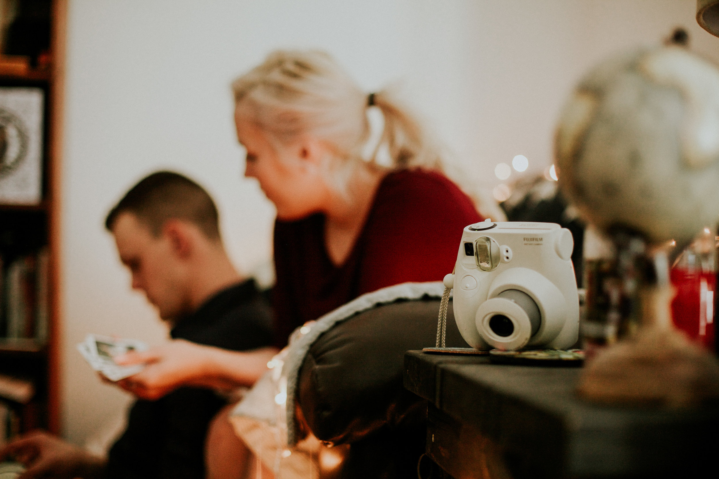 tacoma photographer cute couple snuggling on couch in home session&nbsp;