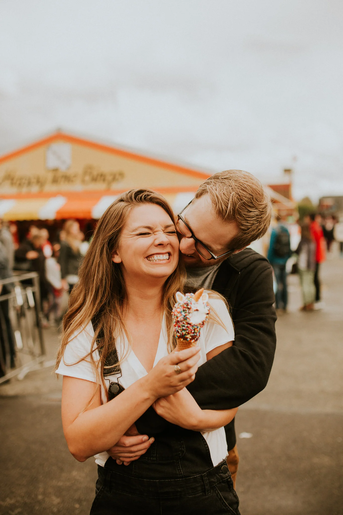state fair engagement photos with unicorn icecream cone and its super vibey and trendy and would probably get featured on instagram.