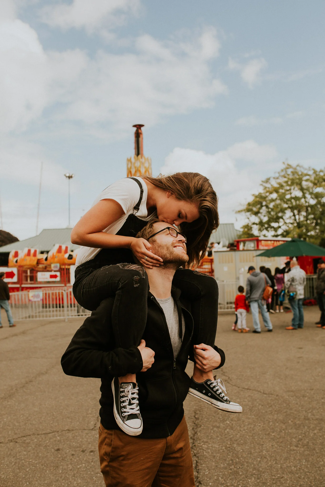 Cute couple having their engagement session taken at the fair with icecream cone, Puyallup fair engagement session, Pnw elopement photographer, - pnw wedding photographer - pnw intimate wedding - Seattle elopement photographer - Seattle intimate wed…
