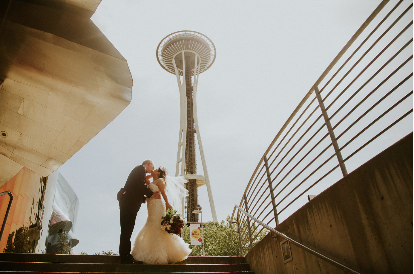 Seattle Space needle. Photos in the surrounding park, ceremony in the space needle, dinner in the space needle. https://www.spaceneedle.com/private-events/