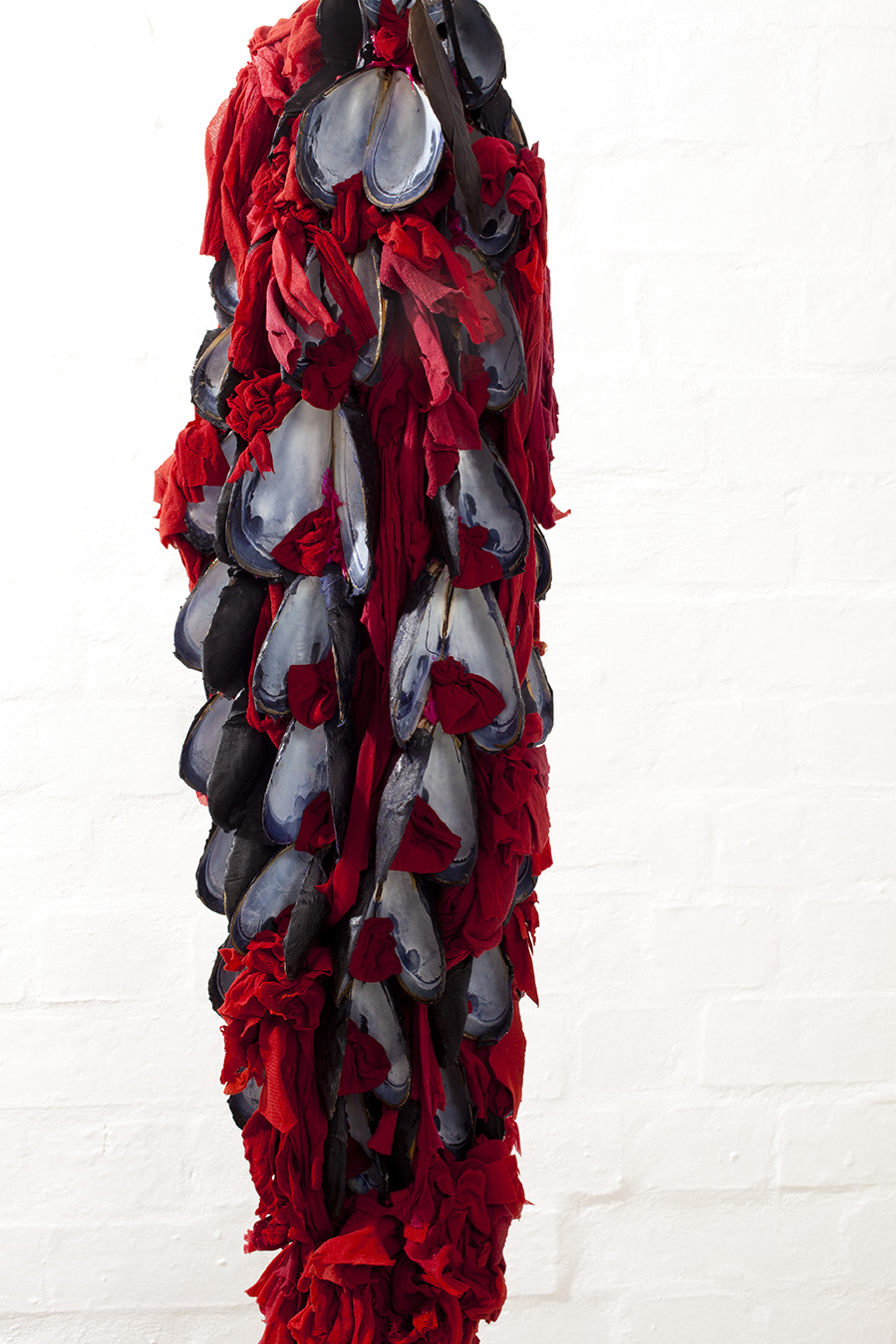 Hanging Midden 2016, (detail, installation view) Mussel shells, red stockings, ( photo: Mark Sherwood)*