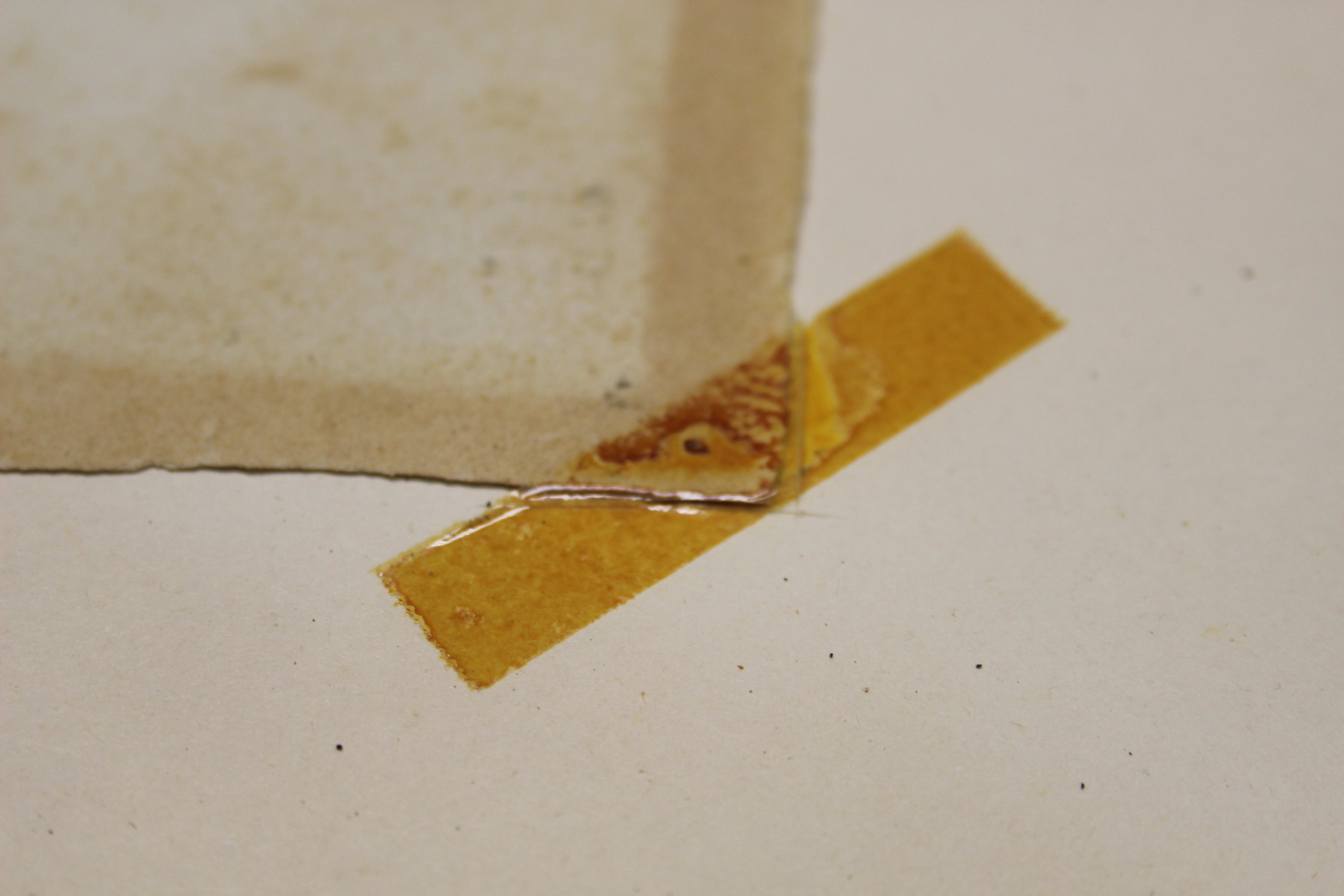 An example of the effects of incorrect framing. See how the paper has gone brown and splotchy. There are multiple reactions happening on this piece included UV burn, Mat burn, Foxing and Staining. These issues could have been avoided through proper conservation framing.