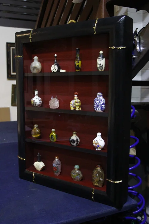 Antique Snuff Bottles framed in hand finished shelf frame