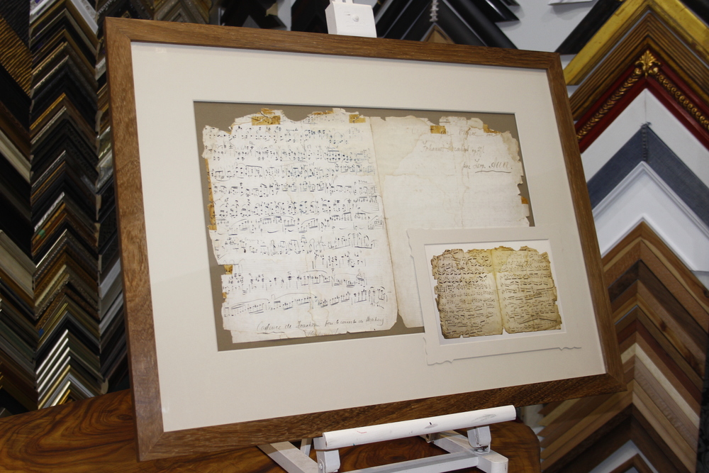 Conservation framing of antique sheet music