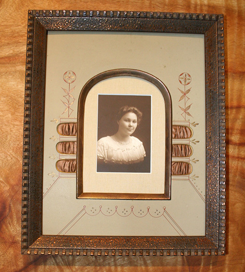 Antique photo framed with antique matting