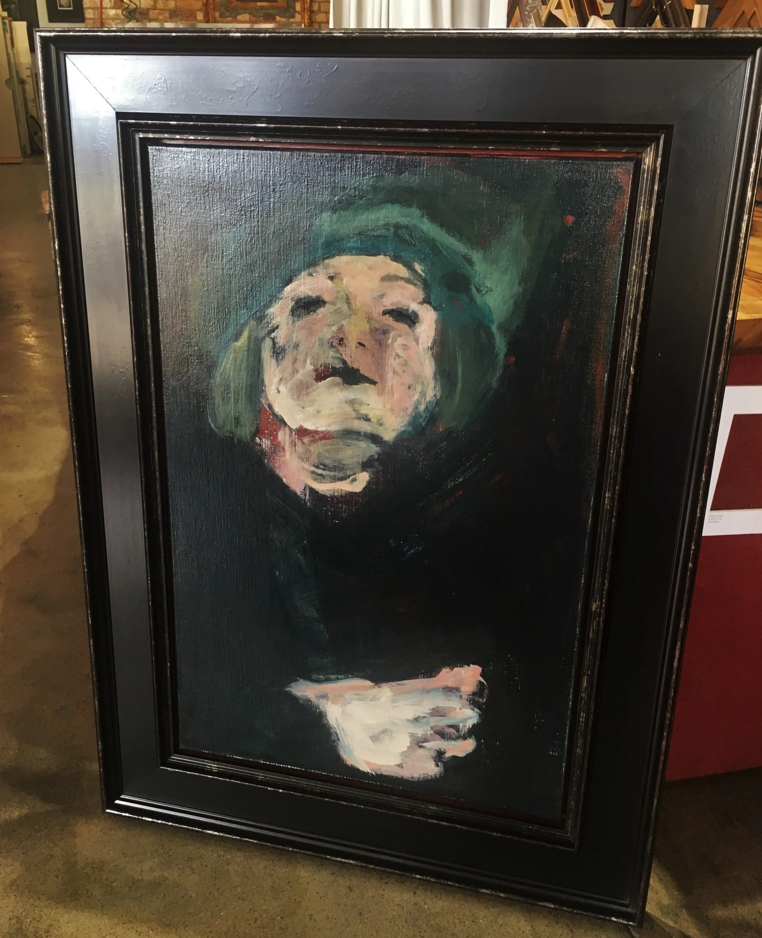 Oil painting in large black casetta frame