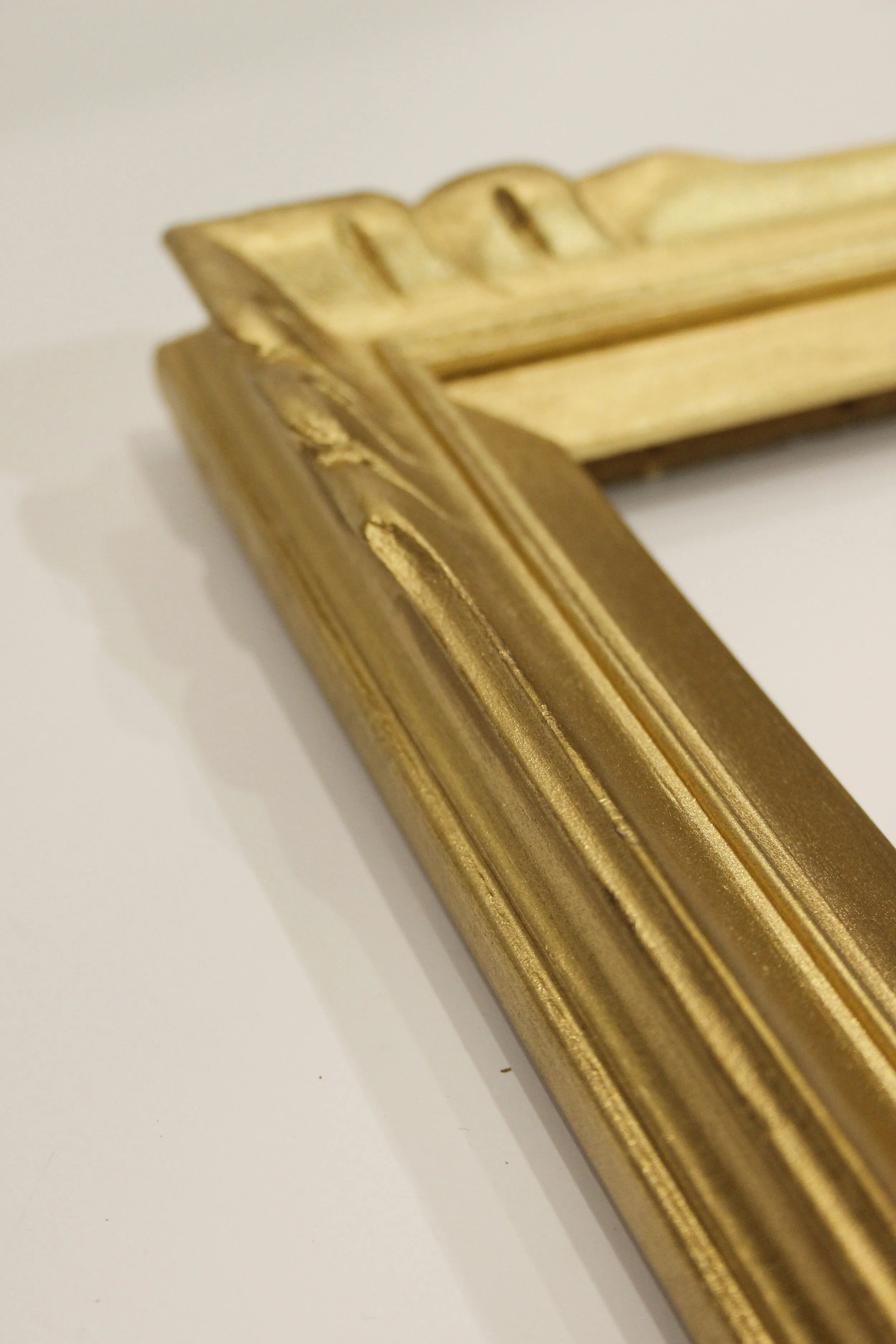 Carved closed corner gilded frame