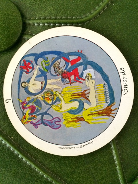 Nine of Swords to the left, Motherpeace Tarot