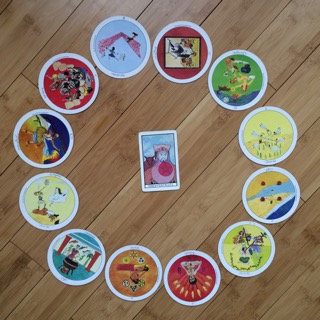 Astrological spread containing Aquarian Tarot Deck and Motherpeace Tarot Deck cards