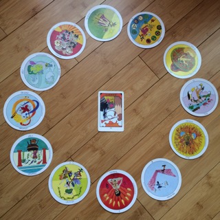 Astrological spread containing Aquarian Tarot Deck and Motherpeace Tarot Deck cards