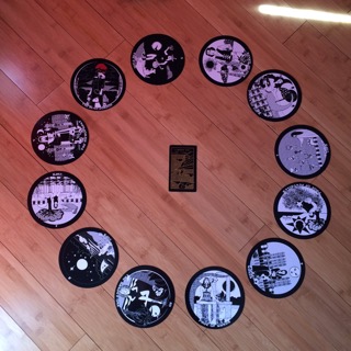 Astrological spread containing The Gorgon's Tarot and Golden Thread Tarot cards