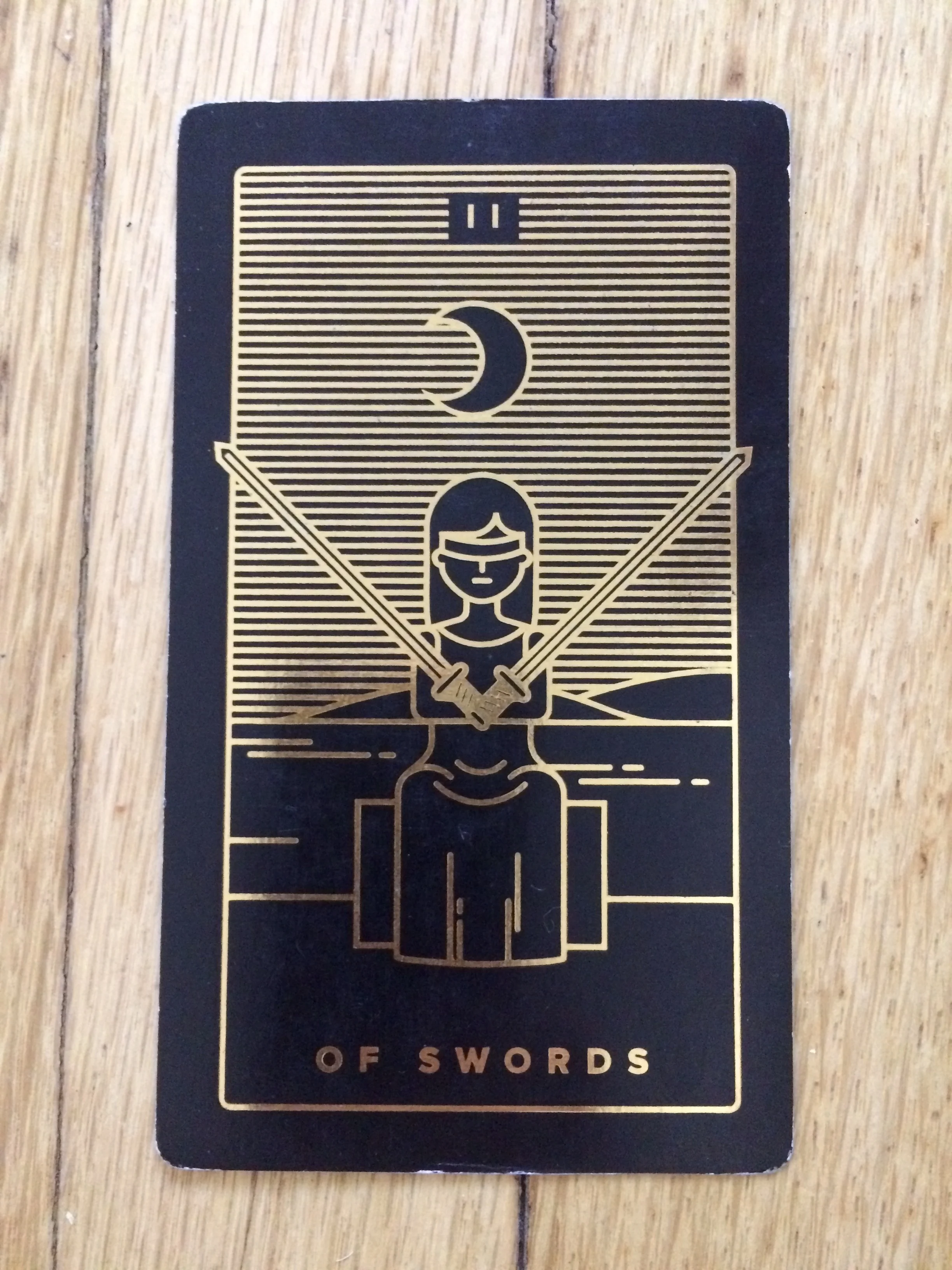 Two of Swords from Golden Threat Tarot 