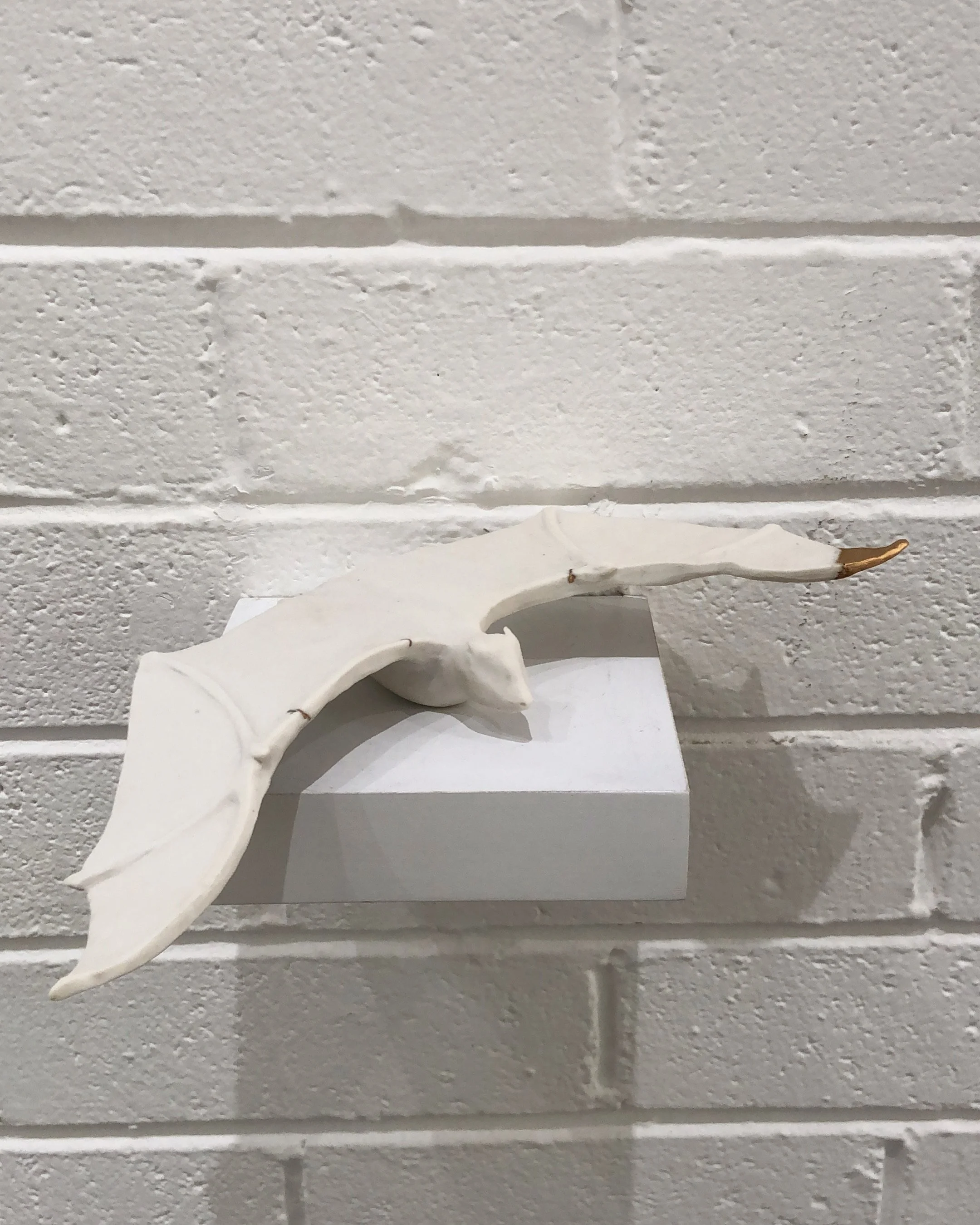 'Between here and not here', 2021. Hand built porcelain & brass. 