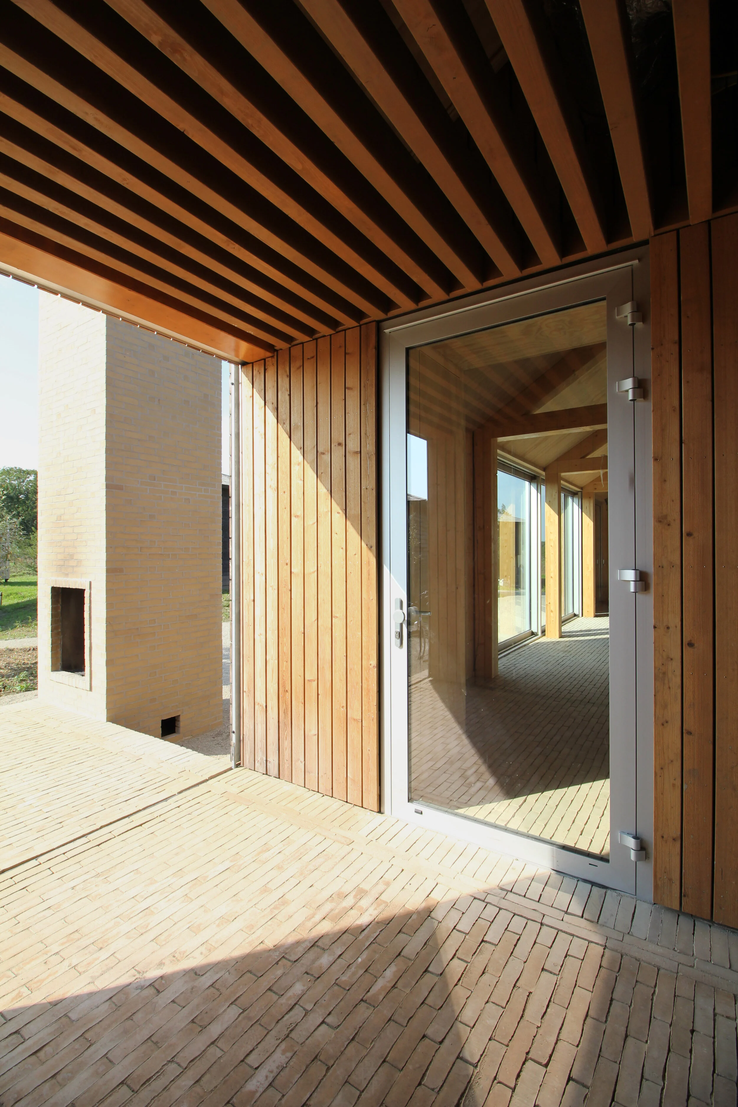  Its building time, costs and carbon footprint are reduced as a result and the use of wood and brick as the main materials makes the whole blend in with nature.  