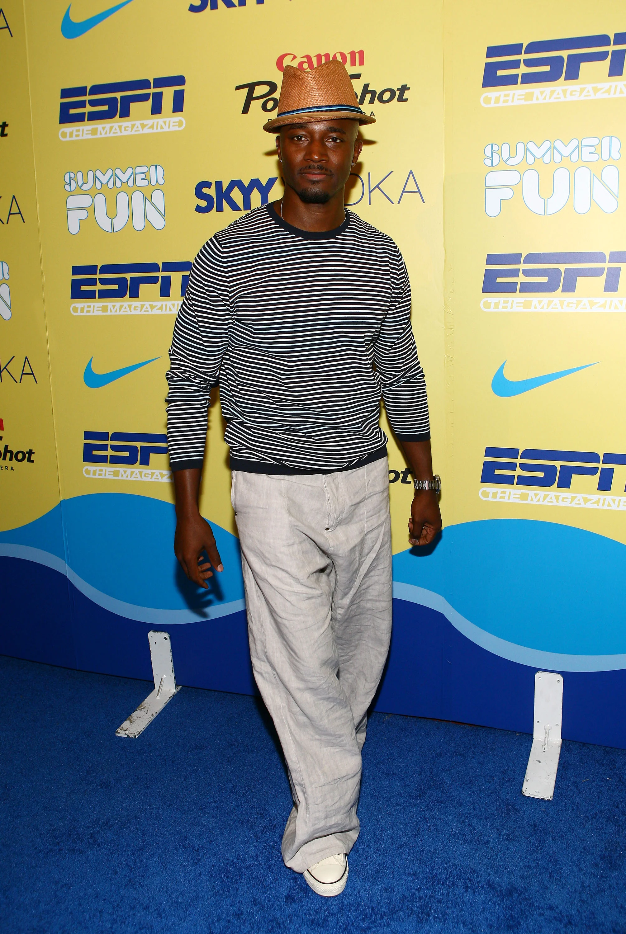 Taye at media wall.JPG