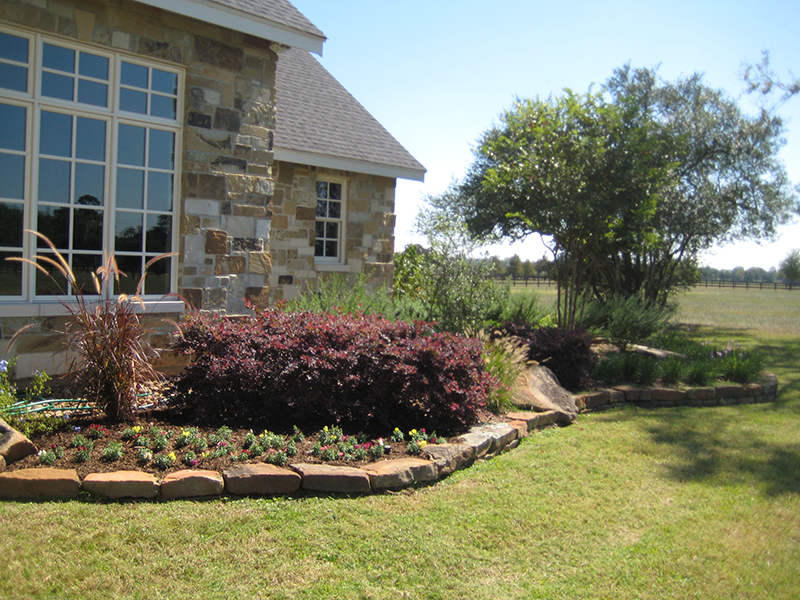 landscape-landscaper-magnolia-the-woodlands-install-design-stone-rock-border-maintenance-fertilization-envy-exteriors.jpg