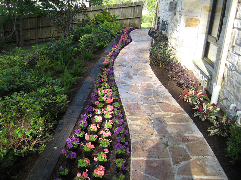 stone-walkway-pathway-landscape-french-country-formal-seasonal-landscaping-ideas-landsacper-installer-installation-plants-side-of-house-the-woodlands-best-envy-exteriors-spring-montgomery-spring-houston-cypress-conroe.jpg