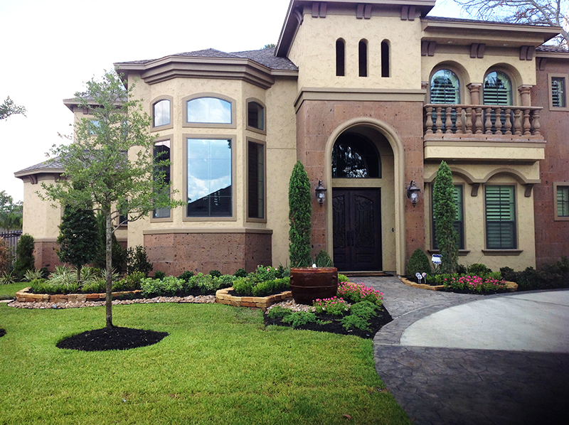 tuscan-style-landscape-water-feature-moss-rock-stone-wall-italian-cypress-bull-rock-border-Spring-landscaper-landscaping-best-the-woodlands-houston-montgomery-magnolia-installation-installers-company-maintenance-lawn.jpg