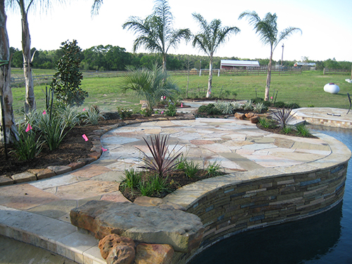 pool-custom-sitting-area-pool-builder-construction-landscape-flagstone-stone-best-pools-designer-landscaper-designs-builds-the-woodlands-houston-spring-magnolia-conroe-montgomery-cypress.jpg