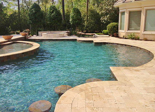 pool-design-cutom-travertine-pavers-decking-deck-waterfall-remodel-renovation-pebble-tec-firepit-seatng-wall-pool-builder-best-company-landscaping-woodforest-the-woodlands-houston-spring-magnolia-conroe-montgomery-cypress.jpg